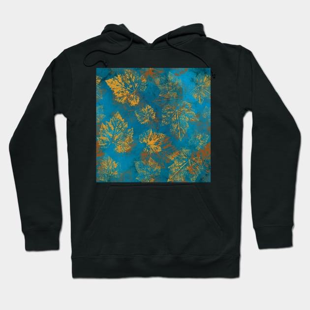 Yellow fall leaves imprints on vibrant blue background. Gold Maple leaves. Golden autumn pattern. Hoodie by likapix